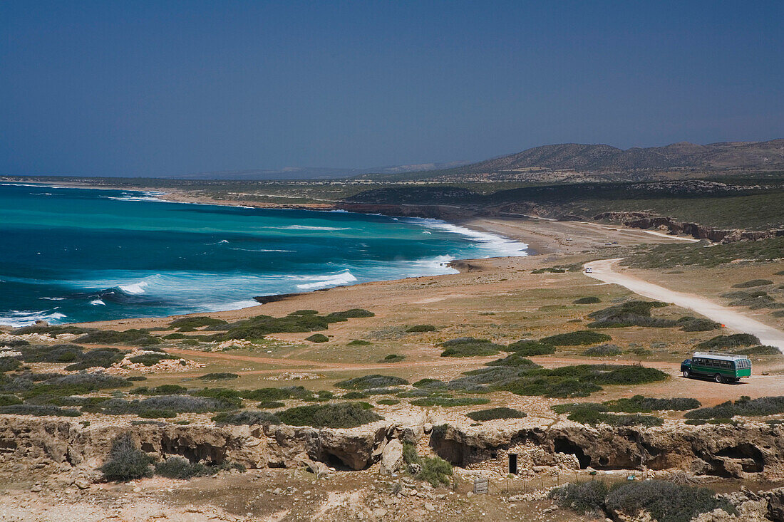 Coastal landscape with bus, coach, Cape Drepano, Akamas Natural Reserve Park, South Cyprus, Cyprus