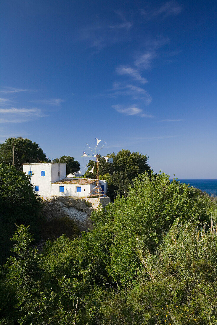 Villa, house on the coast with windmill, Akamas Nature Reserve Park, South Cyprus, Cyprus
