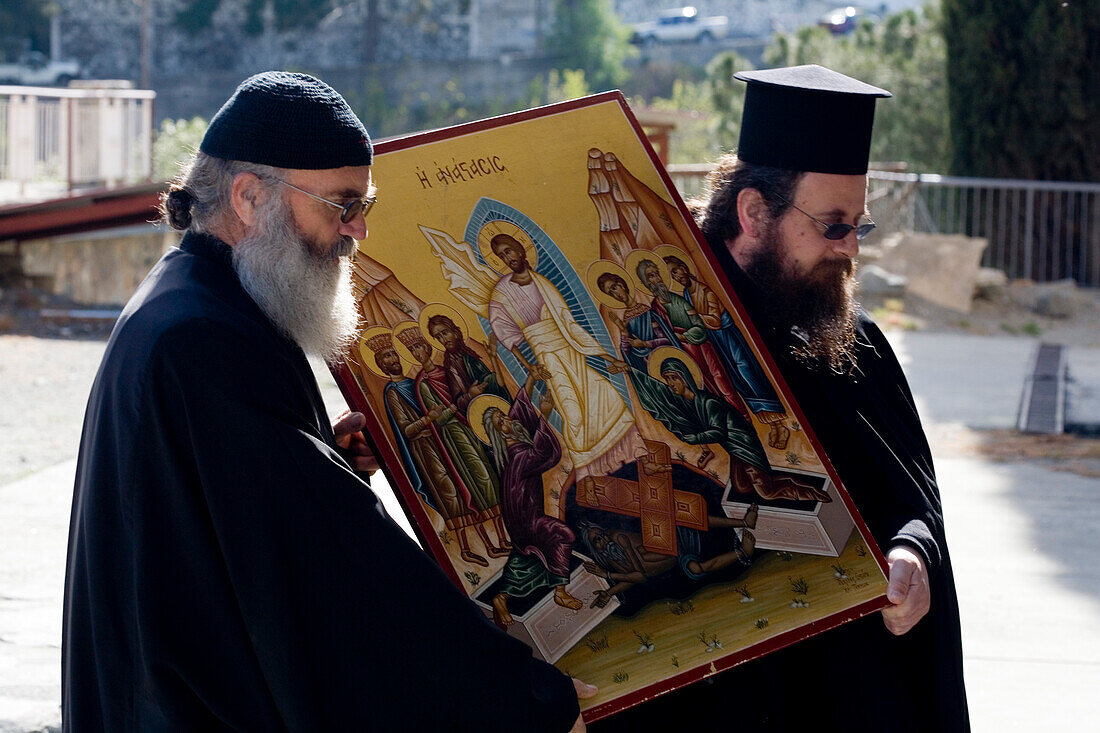 Two orthodox priests holding an icon, procession around church, Agros, Pitsilia region, Troodos mountains, South Cyprus, Cyprus