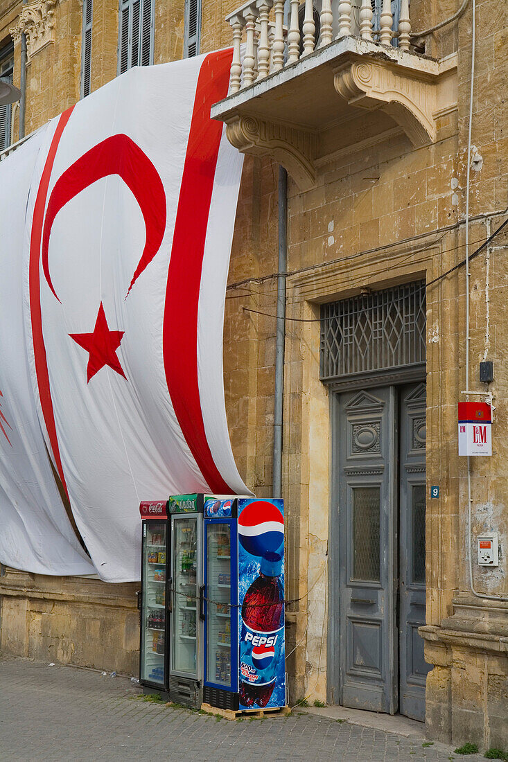 Turkish flag hanging outside a building on Atatürk Meydani street, Atatürk Square, Flag of the Turkish Republic of Northern Cyprus, Lefkosia, Nicosia, North Cyprus, Cyprus