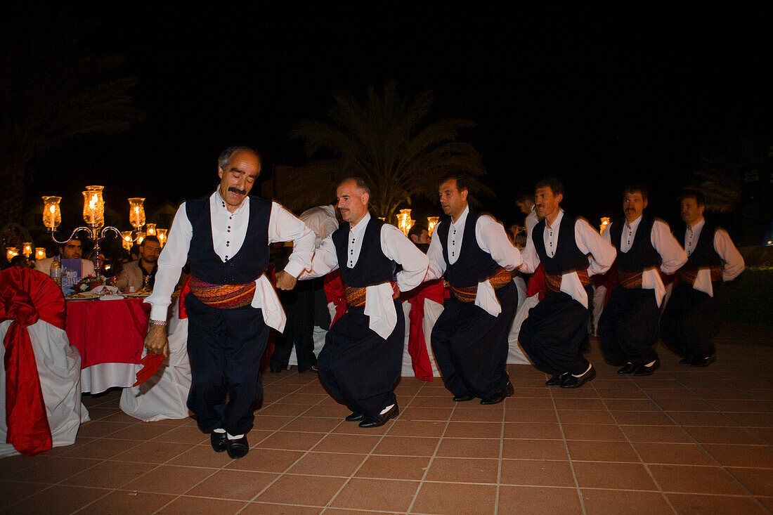A small group of local men dancing in traditional costume, Folklore, Folk dance, Salamis Bay Conti Resort Hotel, Salamis, North Cyprus, Cyprus