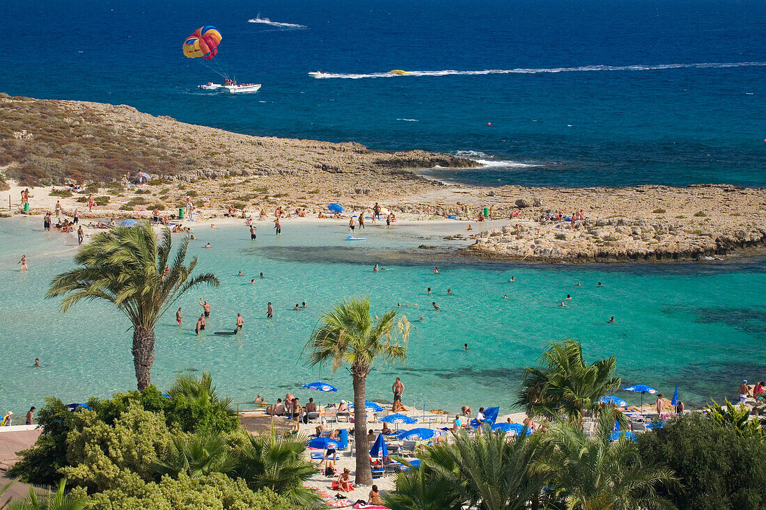 View of Nissi beach with palm trees, Agia Napa, South Cyprus, Cyprus