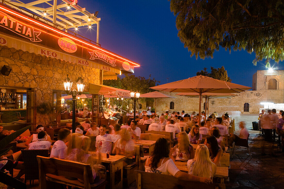 Young men and women sitting in a restaurant, bar, Nightlife in Agia Napa, South Cyprus, Cyprus