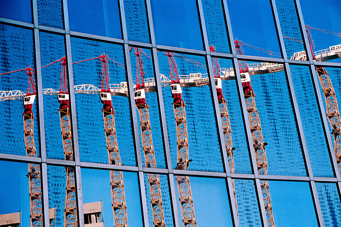 Reflection of construction cranes