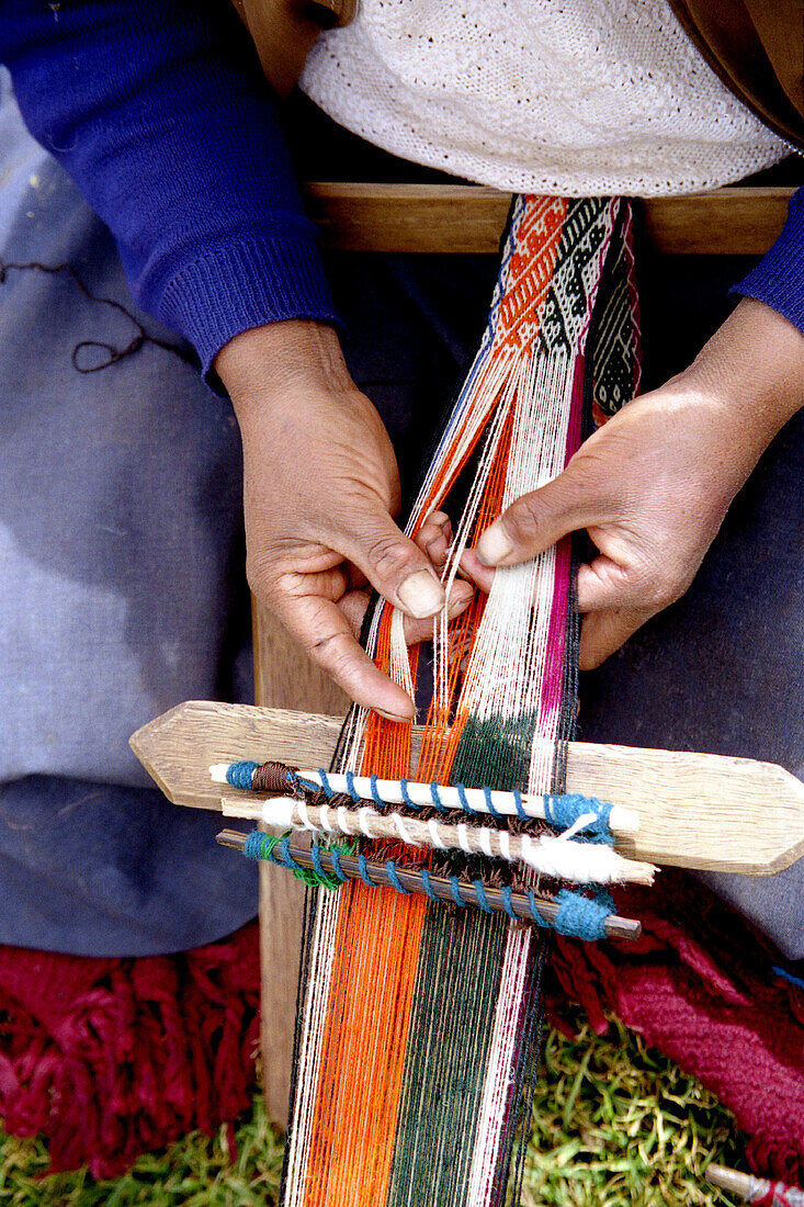 Woman weaving. Peru