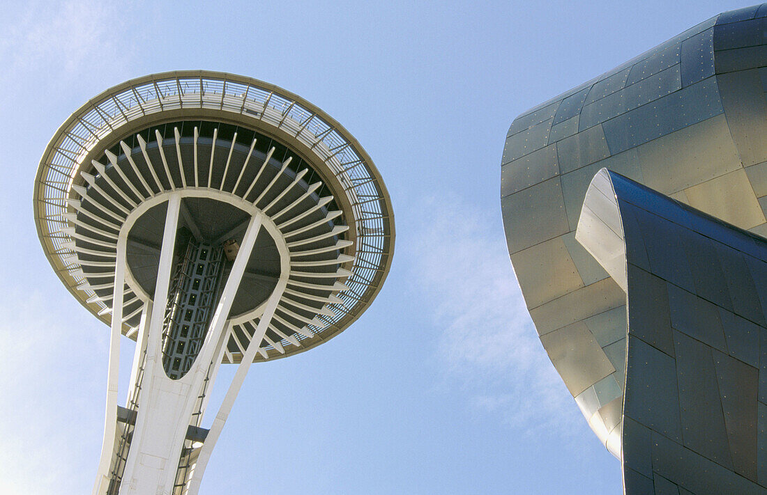 Experience Music Project (interactive music museum built by Frank O. Gehry) with Space Needle at evening. Seattle. Washington. USA