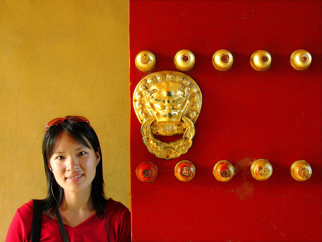 Girl at gate Door. The Temple of Heaven. Beijing. People s Republic of China