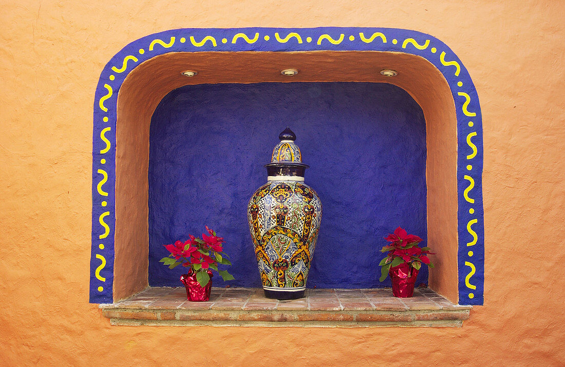 Pot and poinsettias, wall decoration. Puerto Vallarta. Mexico