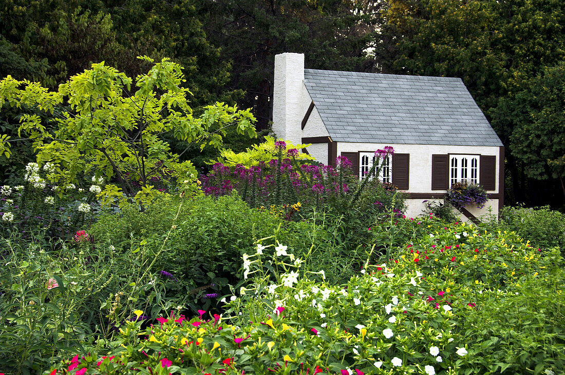 Grandma s Cottage in the flowers gardens of the English Gardens in Winnipeg, Manitoba Canada.