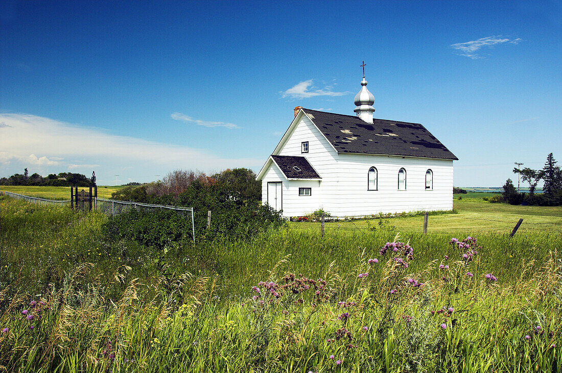 A small country church, The Sacred Heart of Jesus Ukrainian Catholic Church off Highway 2 in rural Saskatchewan, Canada.