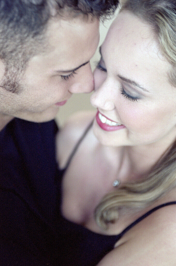 close up of young couple embracing