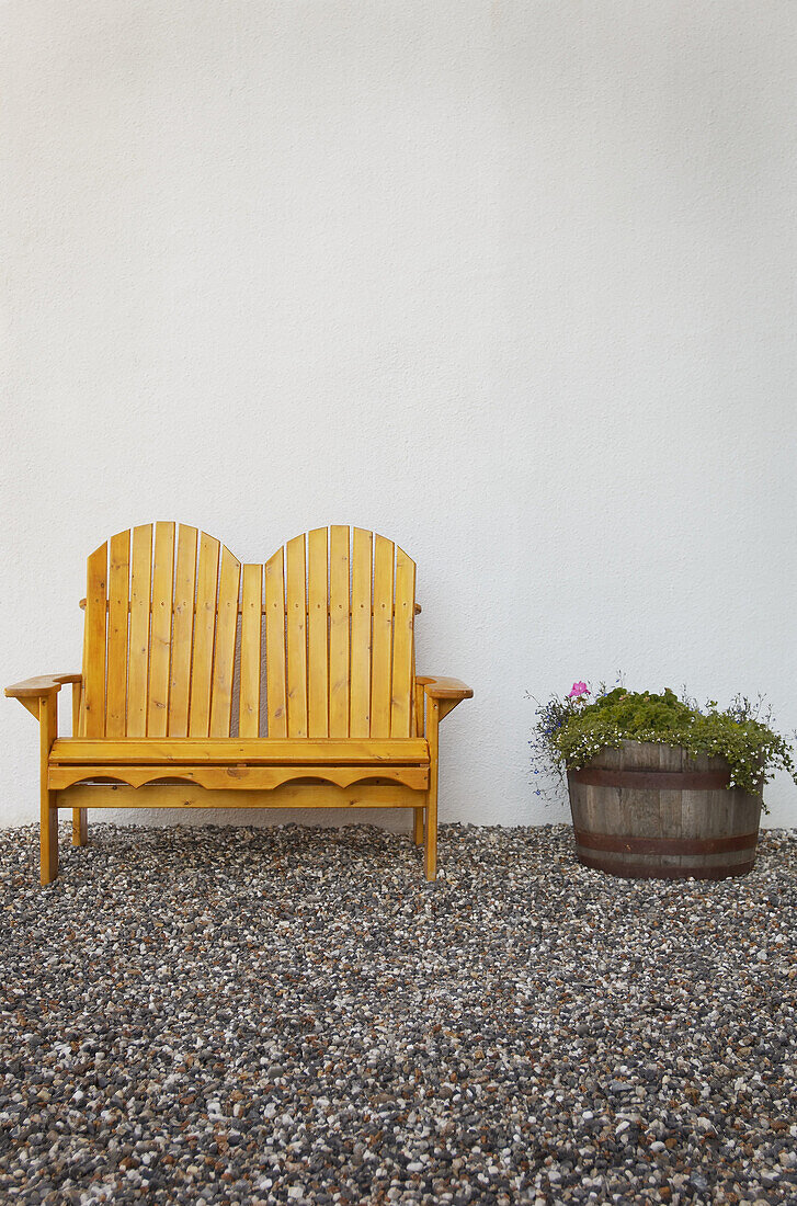 wooden bench beside flower planter
