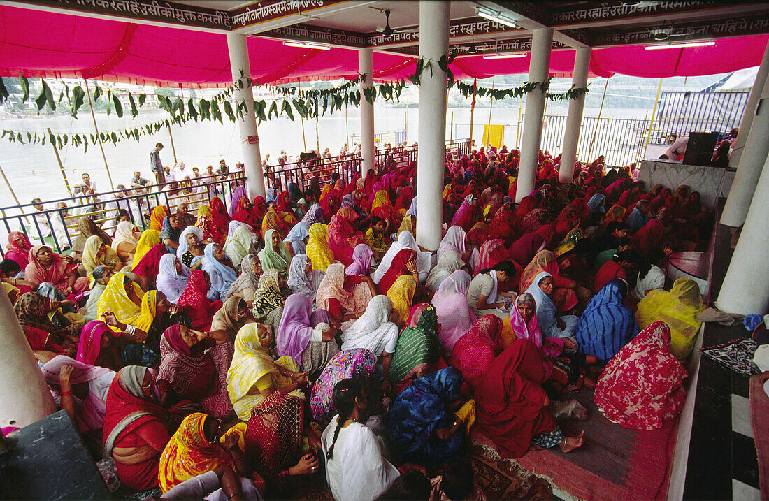 Women in a Mantra Yoga ceremony. Rishikesh. Uttar Pradesh. India.