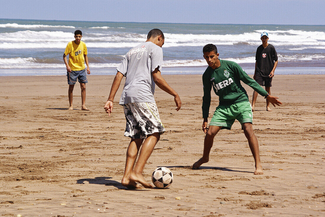 Men playing soccer. Azemmour. Morocco. Africa