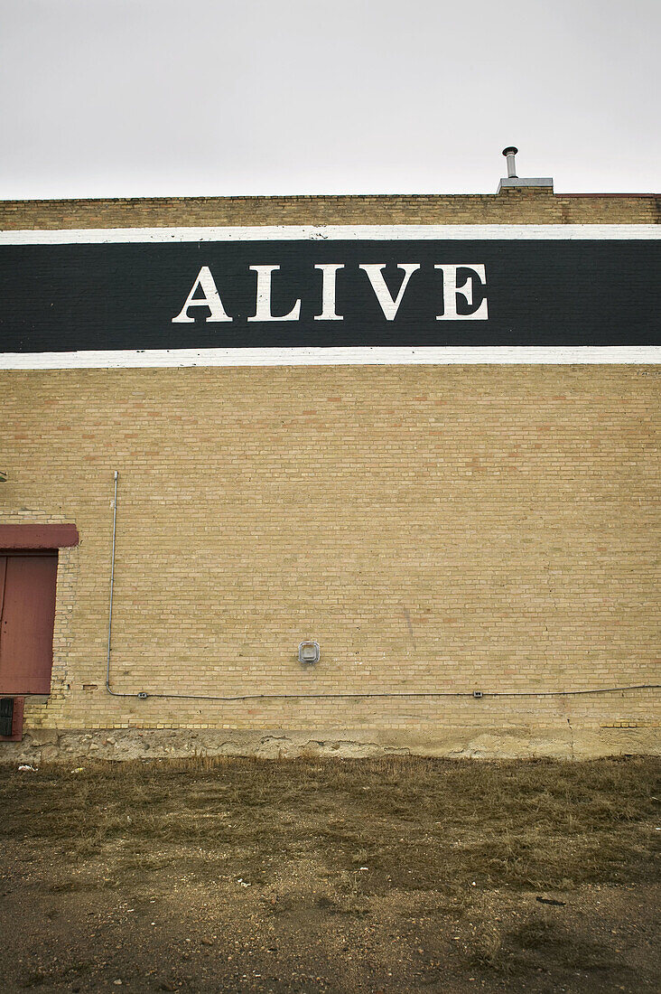 The word alive is written on a building in Saskatchewan, Canada.