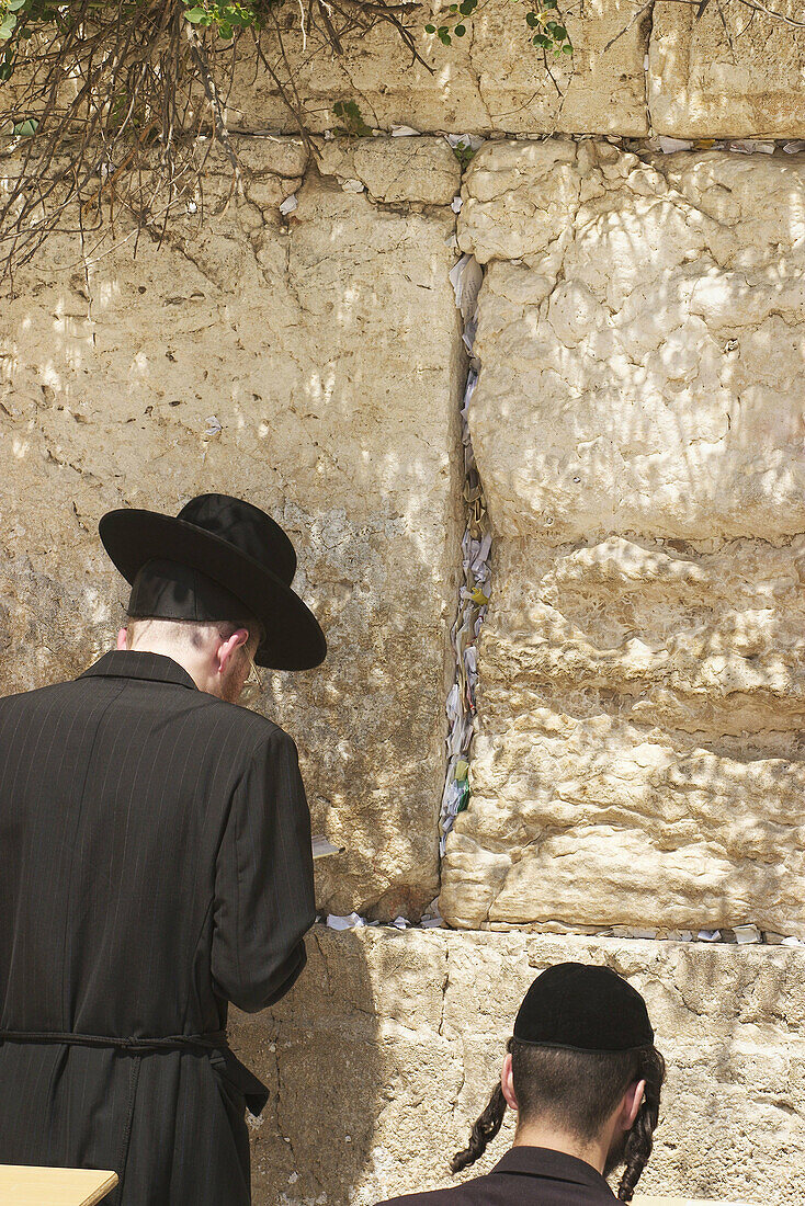 Praying at the wailing wall in Jerusalem, Israel.