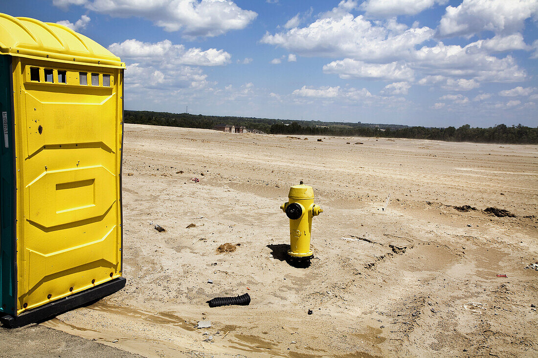Portable toilet in a construction site of new homes.
