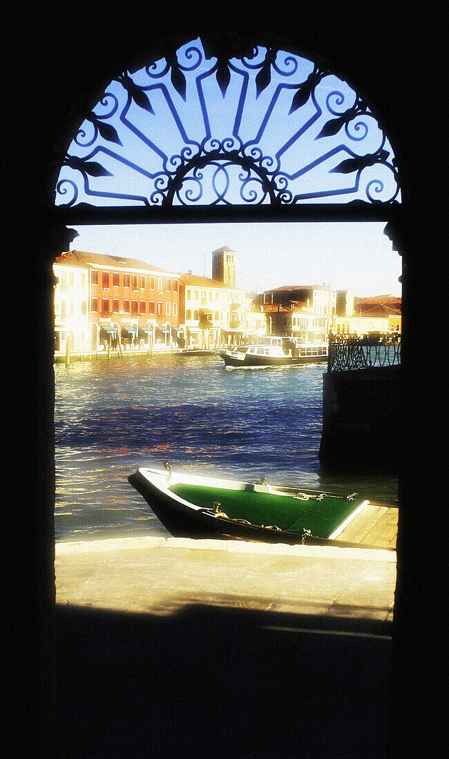 View from arched doorway. Murano Island, Venice. Italy