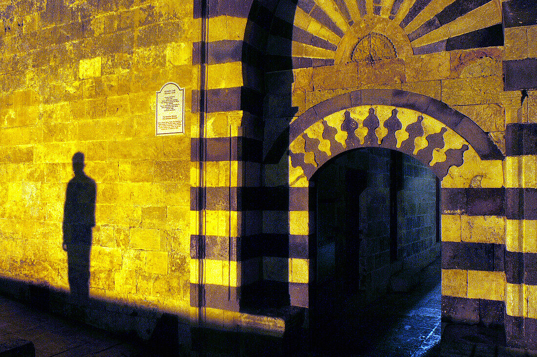 Silhouette on wall beside entrance to mosque of Sanli Urfa castle. Anatolia. Turkey