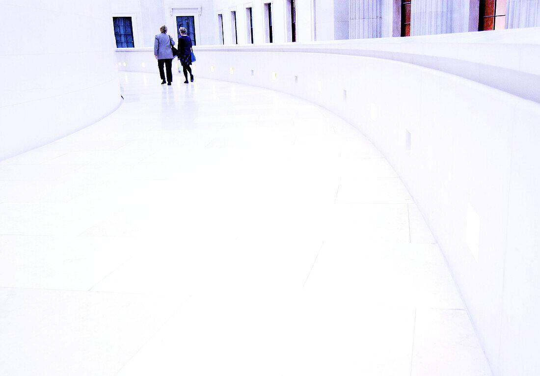 Two women at the end of white walkway, British Museum. London. England