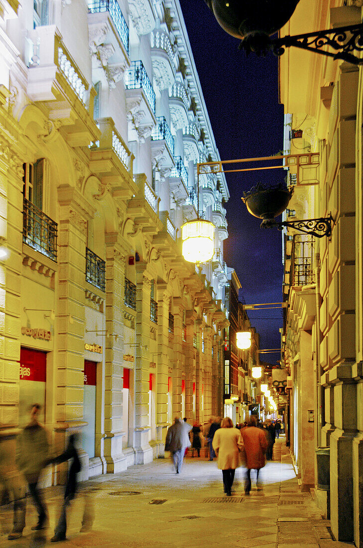 Pedestrian street in the center of Granada at night. Andalucia. Spain