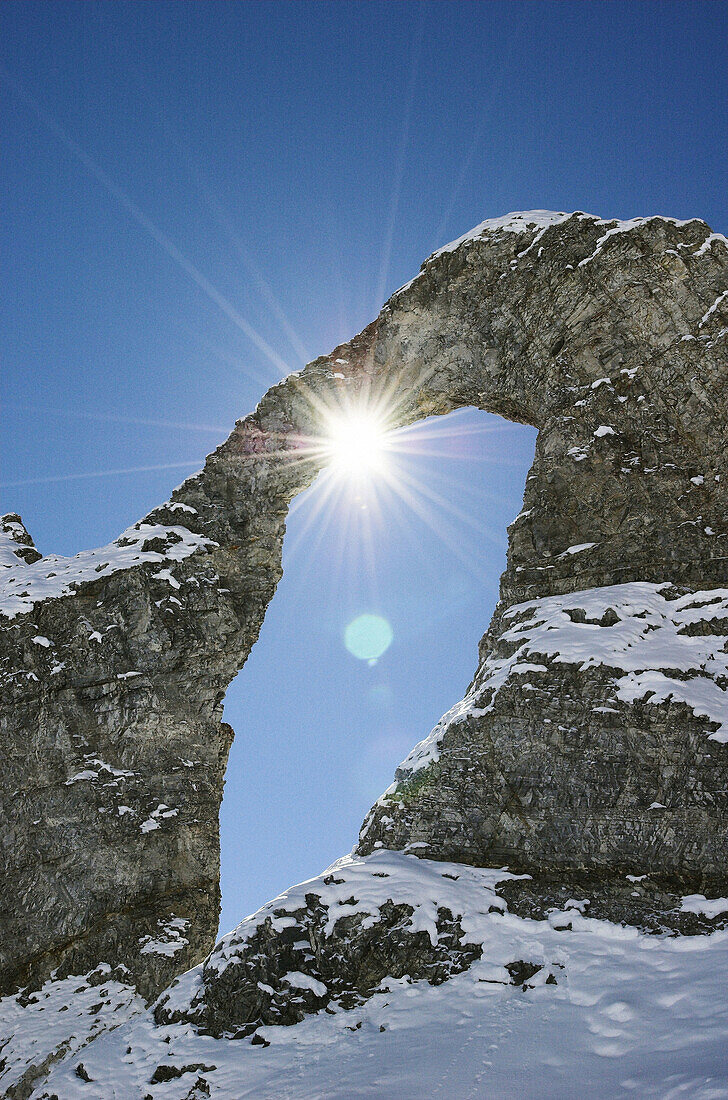 Natural stone arch Aiguille Percée . Tignes. The Alps. France