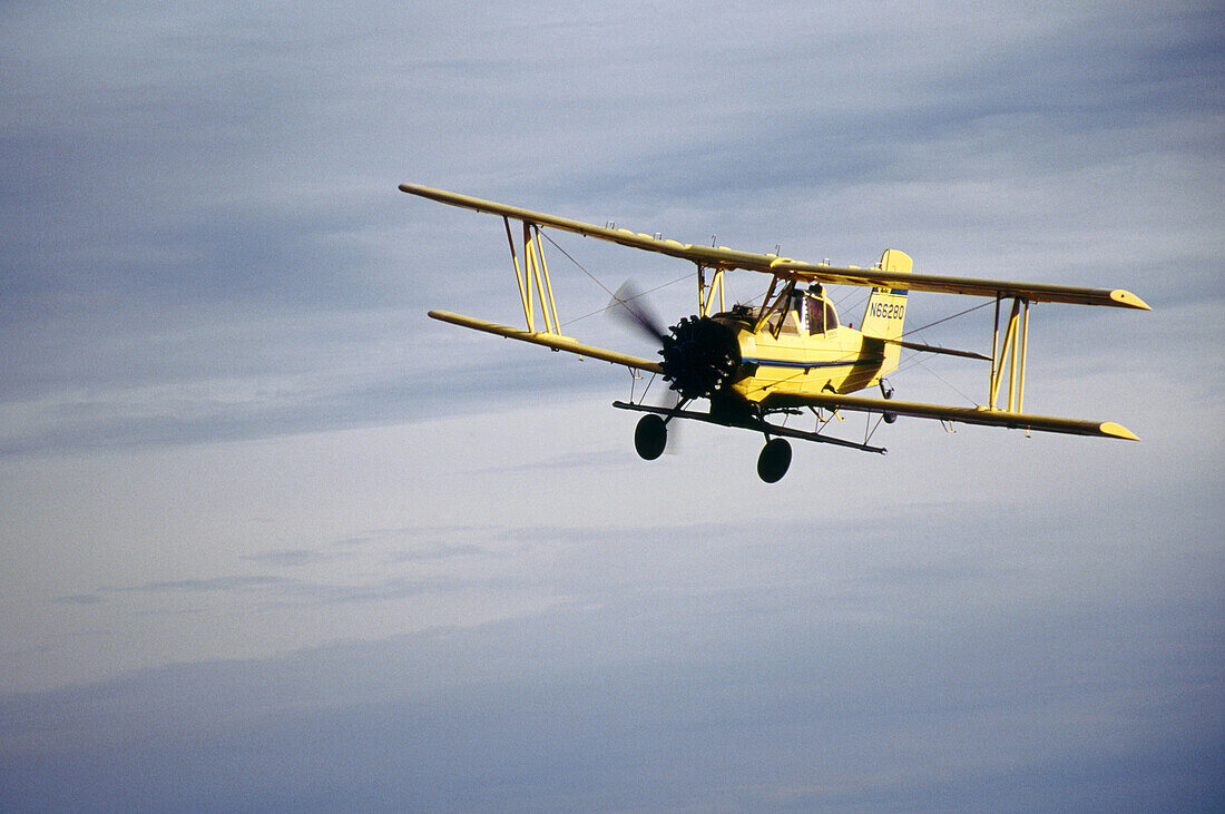 Crop duster approaches for landing at an airstrip just North of Oaksdale. Withman County, Washington, USA