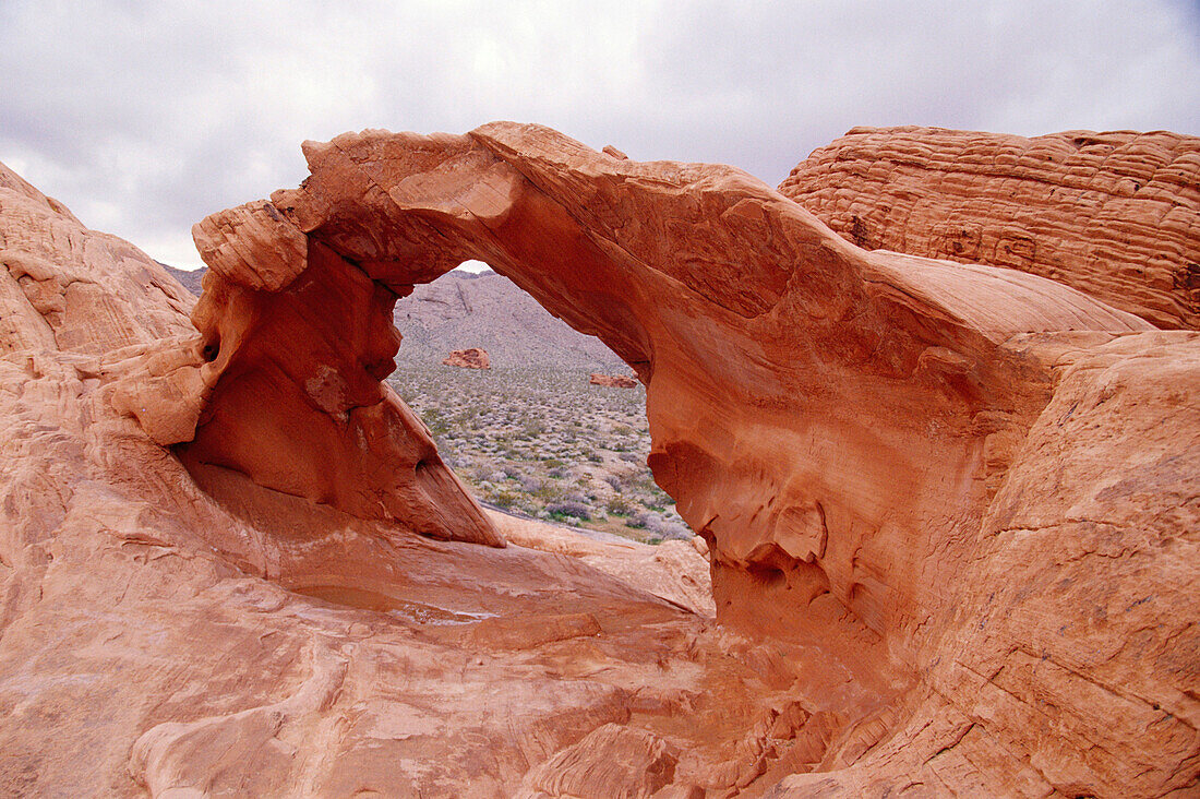 Arch rock, red sandstone formations at Valley of Fire State Park near Las Vegas. Southern Nevada, USA