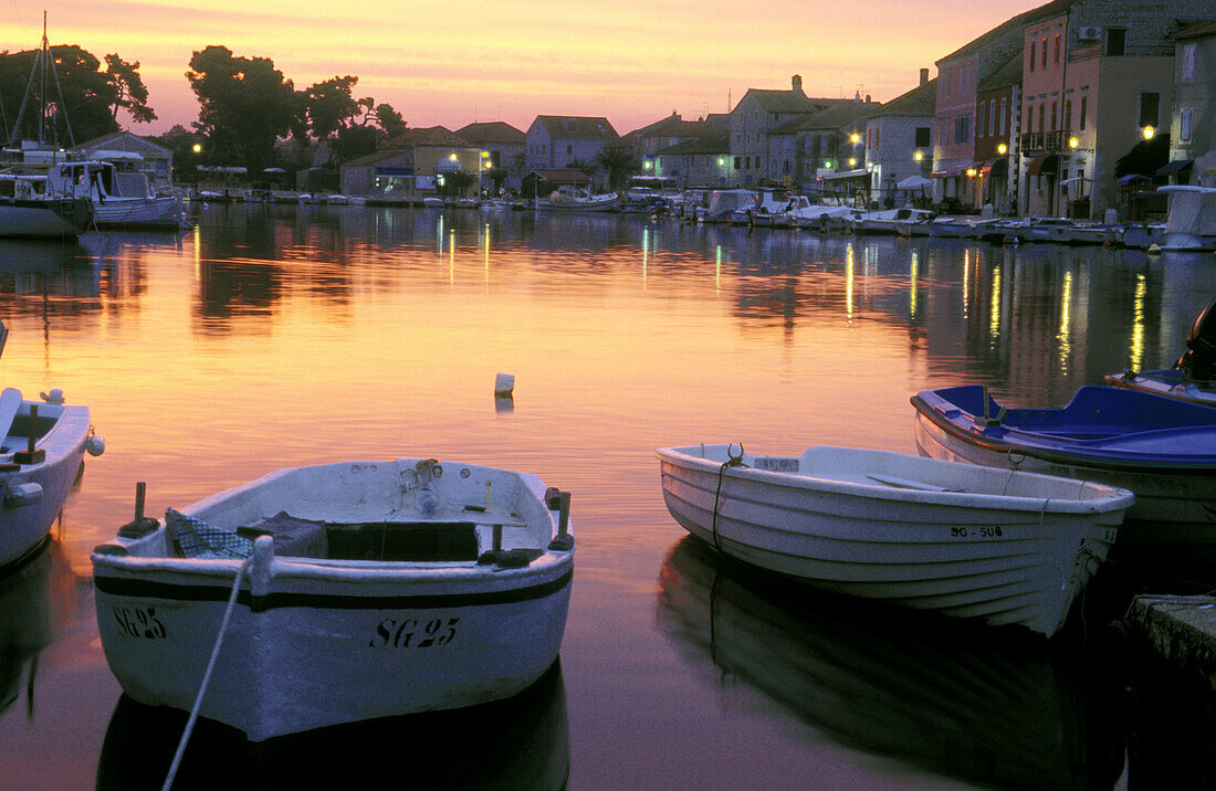 Sunrise over Stari Grad harbor with fishing boats. Hvar Island, Dalmatia. Croatia