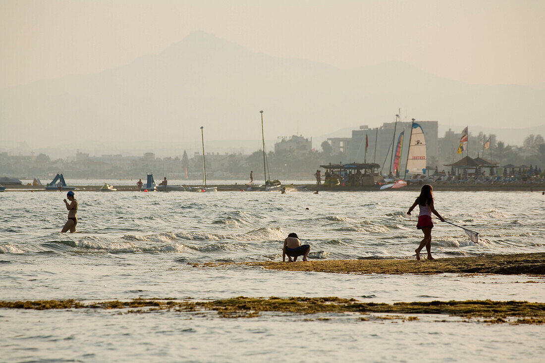 Children playing on the beach near Larnaka, South Cyprus, Cyprus