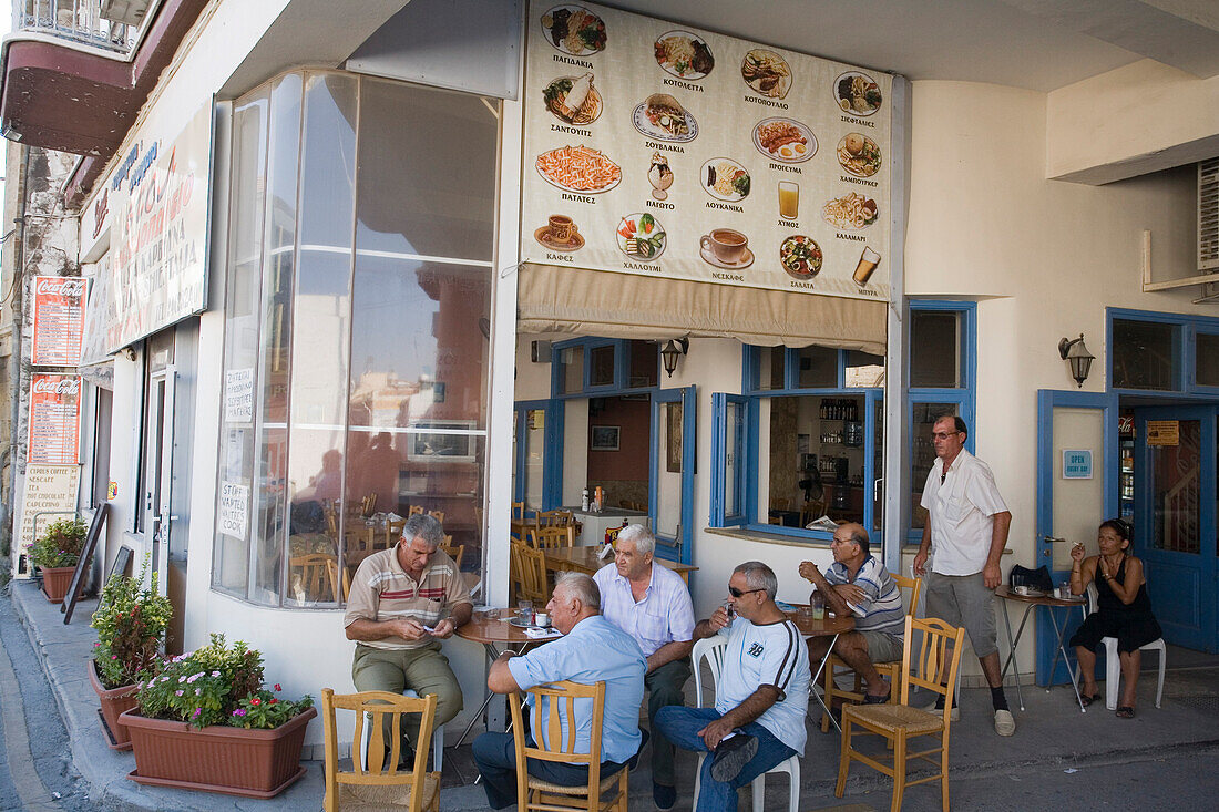 Locals sitting outside a coffee shop, Kafenion, Larnaka, South Cyprus, Cyprus