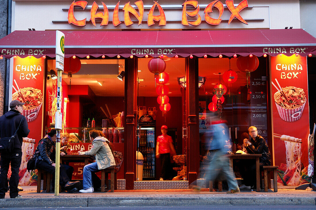 Pedestrians passing Chinese Restaurant, Berlin, Germany