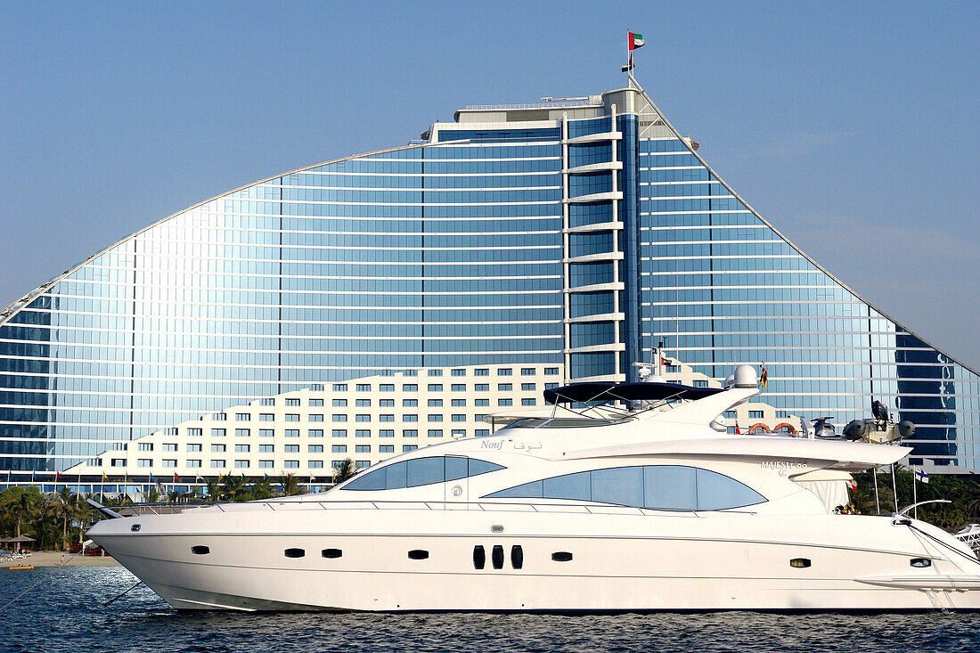 Luxury Yacht anchoring in front of Jumeirah Beach Hotel, Dubai, United Arab Emirates, UAE