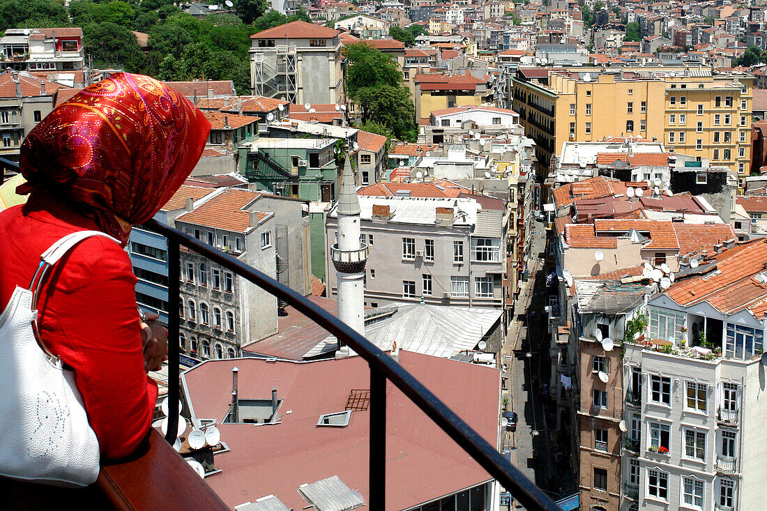 Woman overlooking the city, Istanbul, Turkey