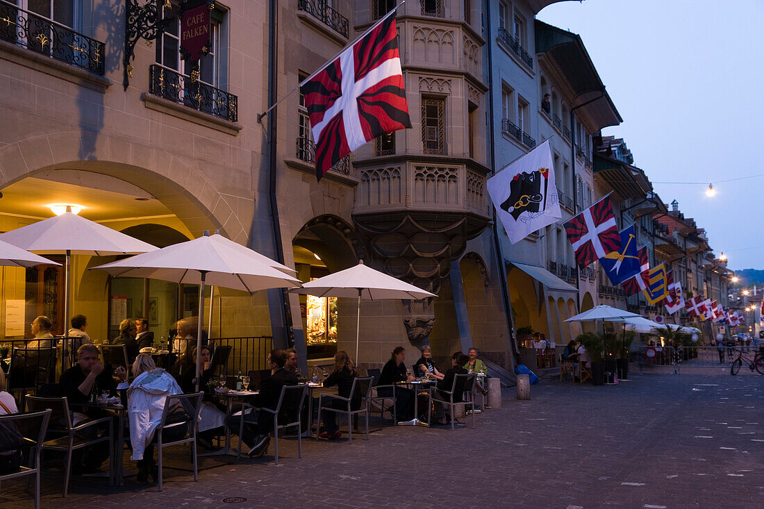 People sitting outside a cafe bar in the Muenstergasse, Old City of Berne, Berne, Switzerland