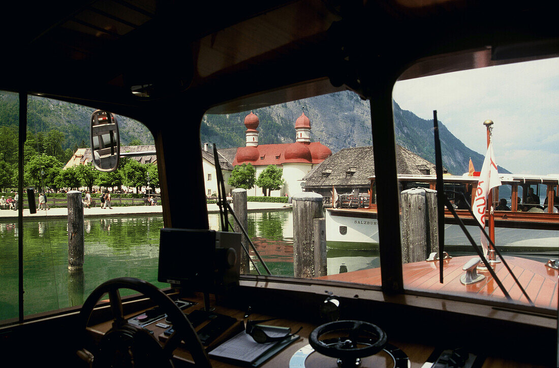 View of St. Bartholomews church at lake Konigssee from a boat, Berchtesgadener Land, Bavaria, Germany