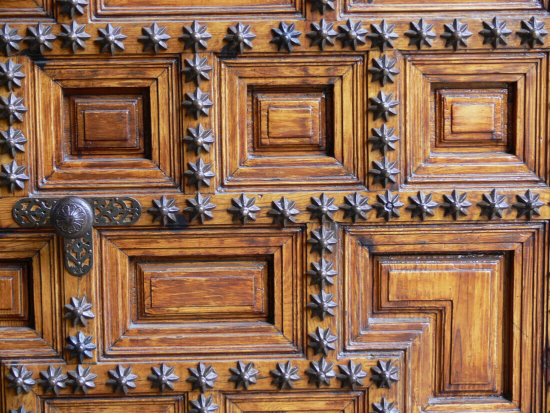 Wooden door of the Hostal de los Reyes Católicos, Santiago de Compostela. La Coruña province, Galicia, Spain