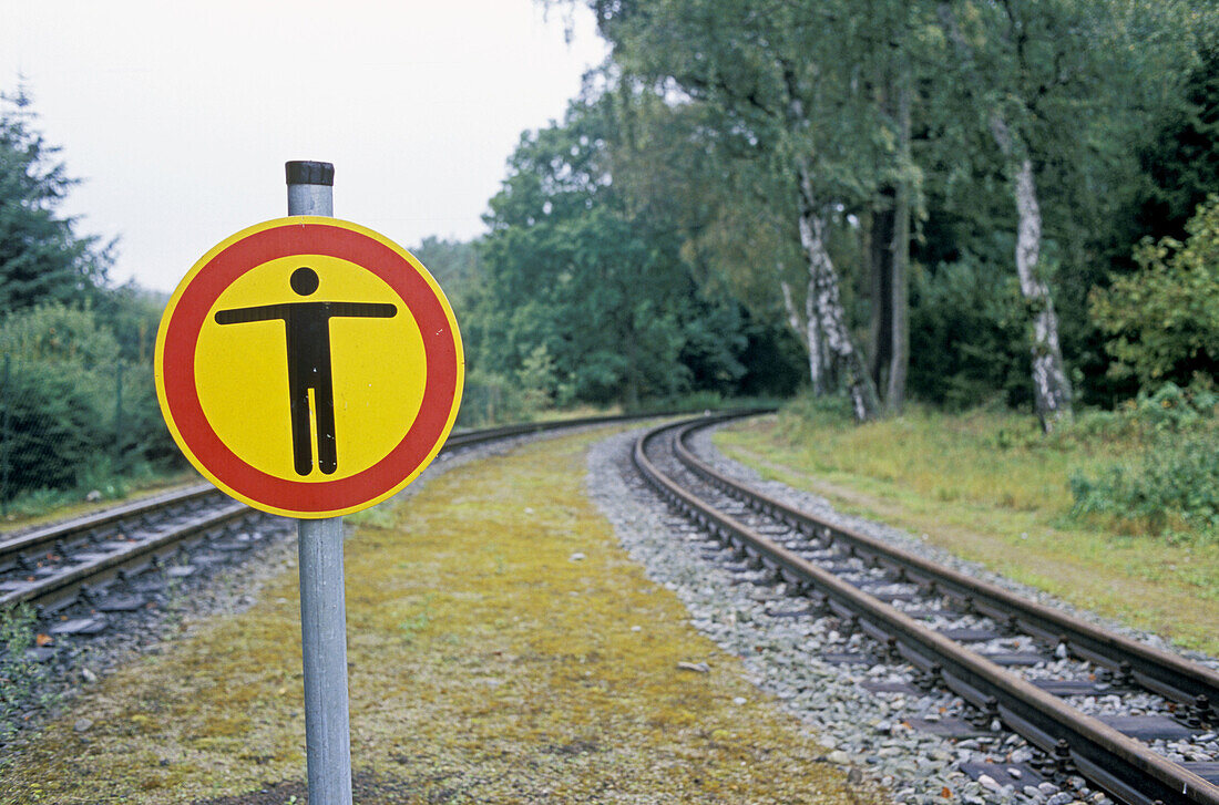 Sign at the railway tracks. Trespassing not allowed, Rügen (Ruegen) island. Mecklenburg Western Pomerania. Germany