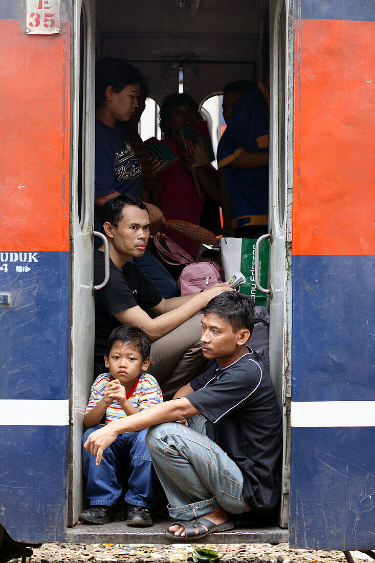 People waiting in the train at Senen train station of Jakarta, Indonesia, Southeast Asia