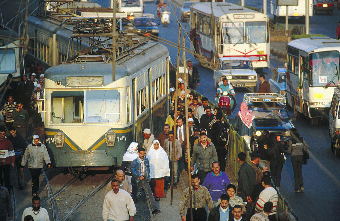 Tramway, buses and cars in a busy street of Cairo. Egypt