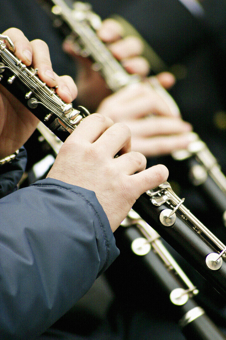 Hands of clarinet players in a band.