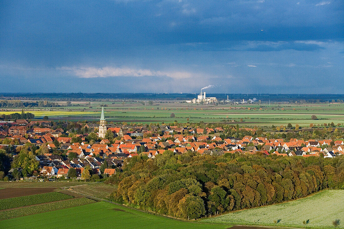 Aerial shot of village near Hanover, factory in background, Lower Saxony, Germany