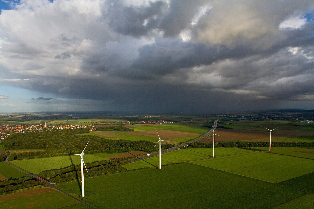 aerial view of wind turbines in the landscape, autobahn, dark clouds, near Hanover, Lower Saxony, northern Germany