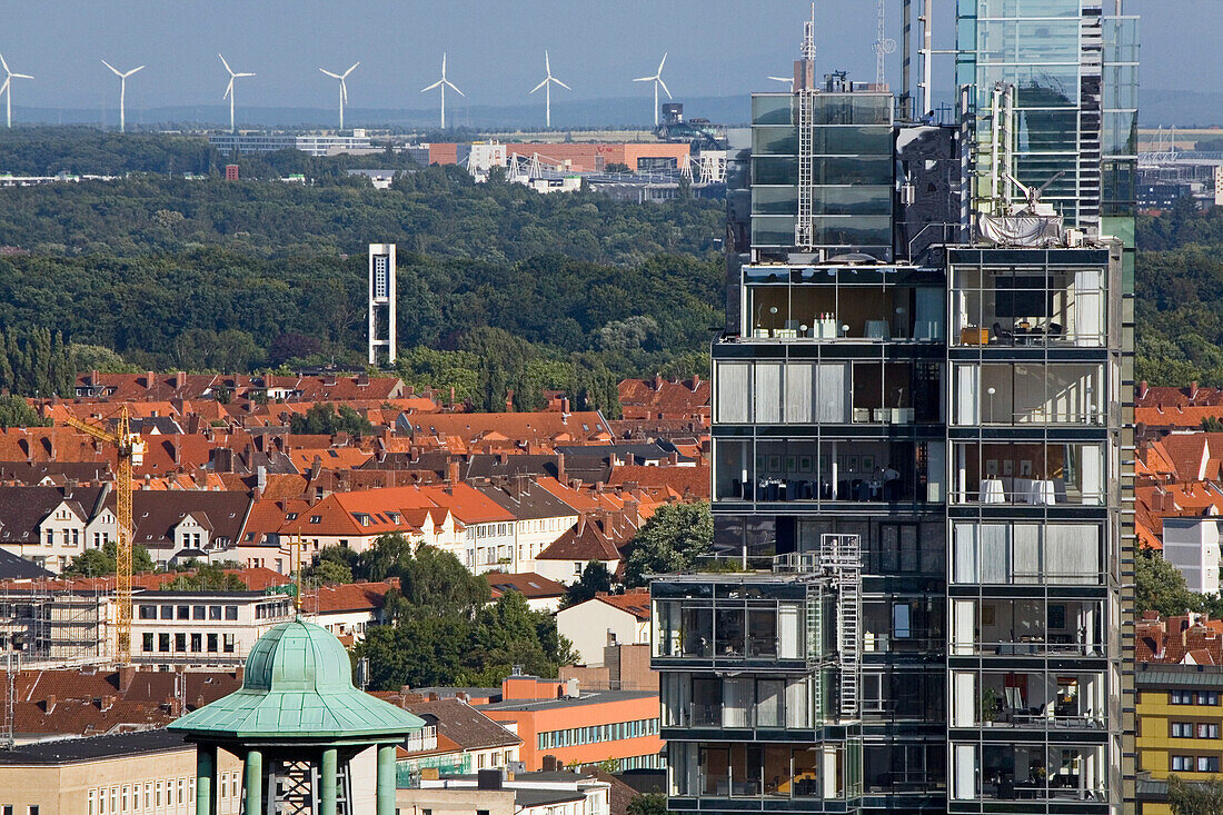 Hanover city centre, with view of the Nord LB Northern German Bank across the roofs of to the green city belt, and wind turbines on the horizon