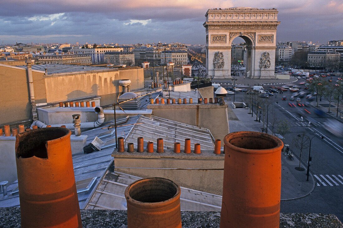 View over roofs onto Arch of Triumph in the evening, Place de l'Etoile, Paris, France, Europe