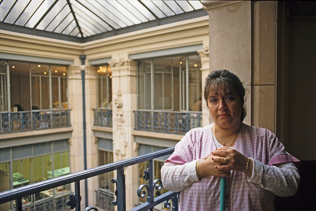 Marie, Concierge, caretaker in the building, a former warehouse now offices, Paris, France
