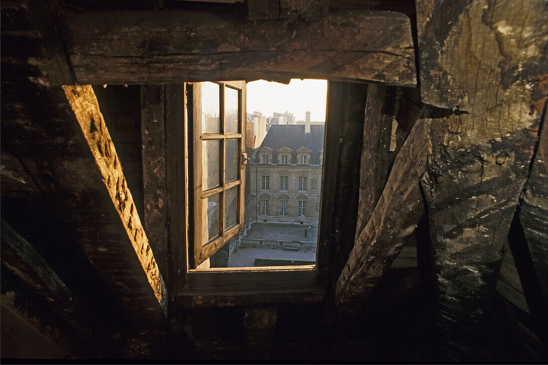 Attic window under the roof, Places Vosges, Paris, France