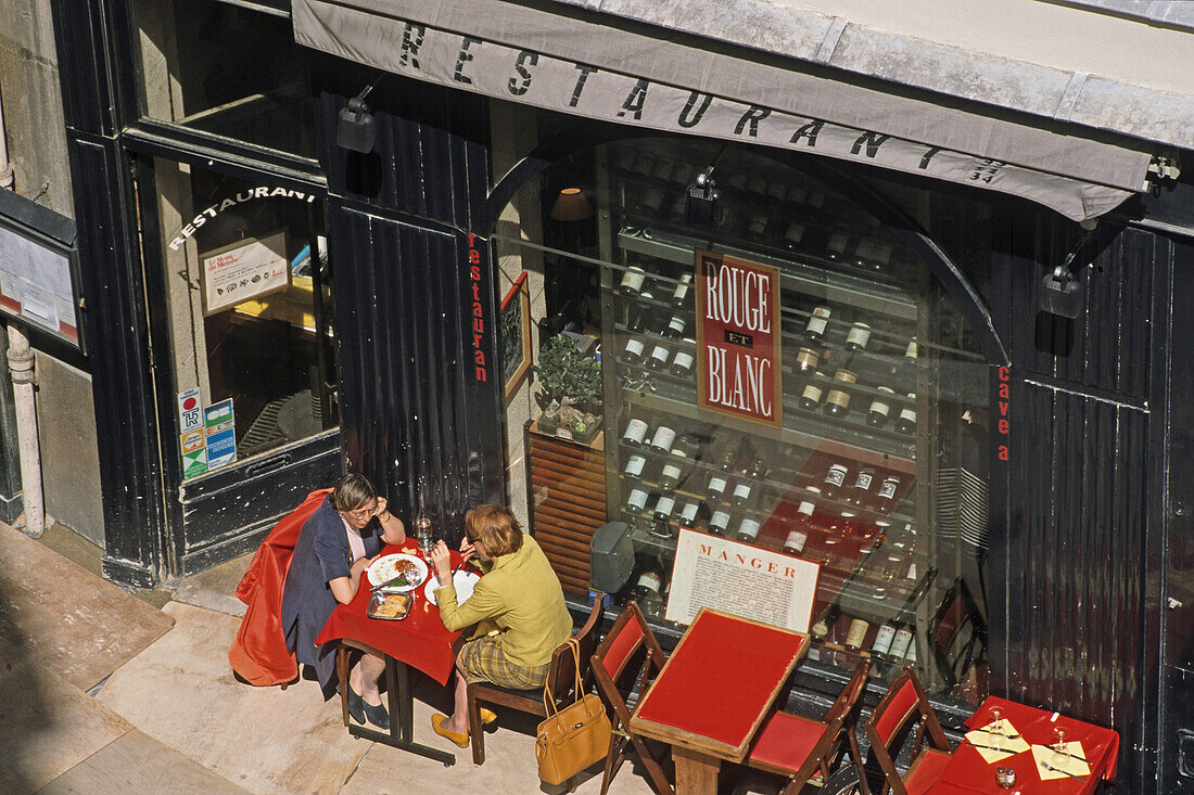 High angle view of people outside a street cafe, Paris, France, Europe