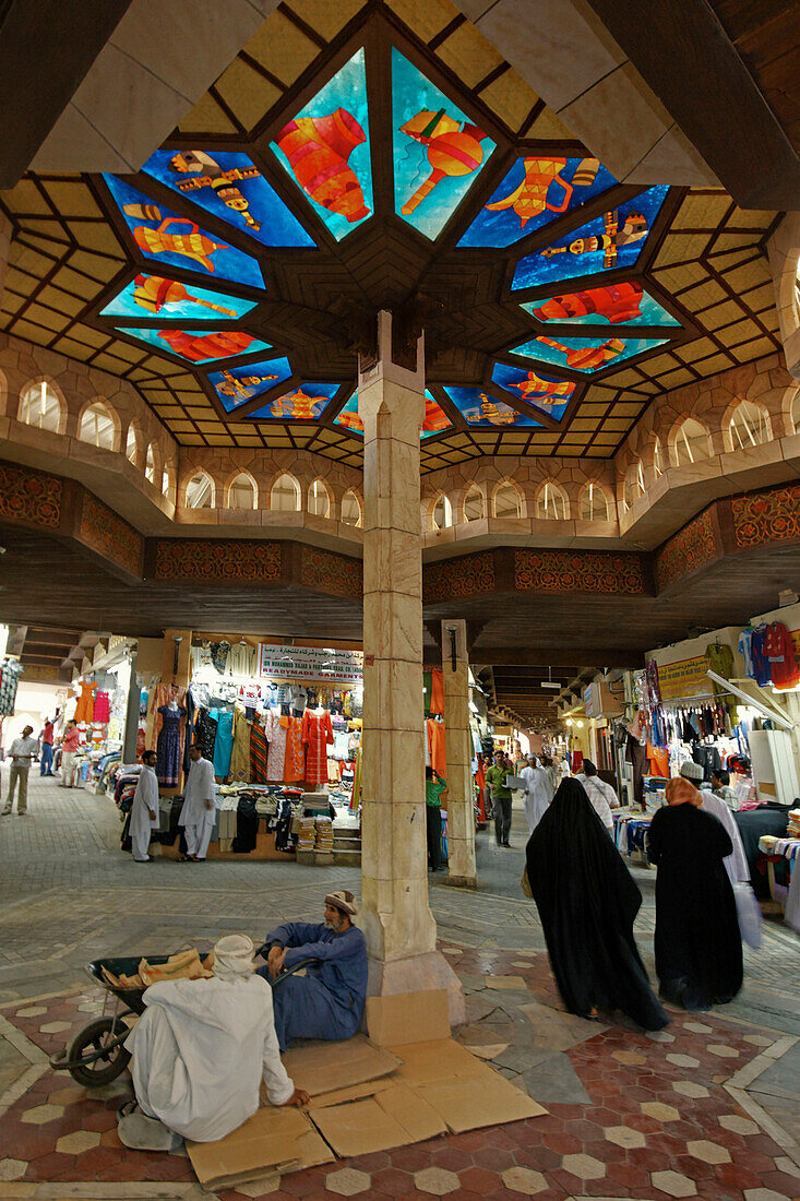 Oman Muscat Mutrah Souk, arab people, colorful ceiling with colorful glas