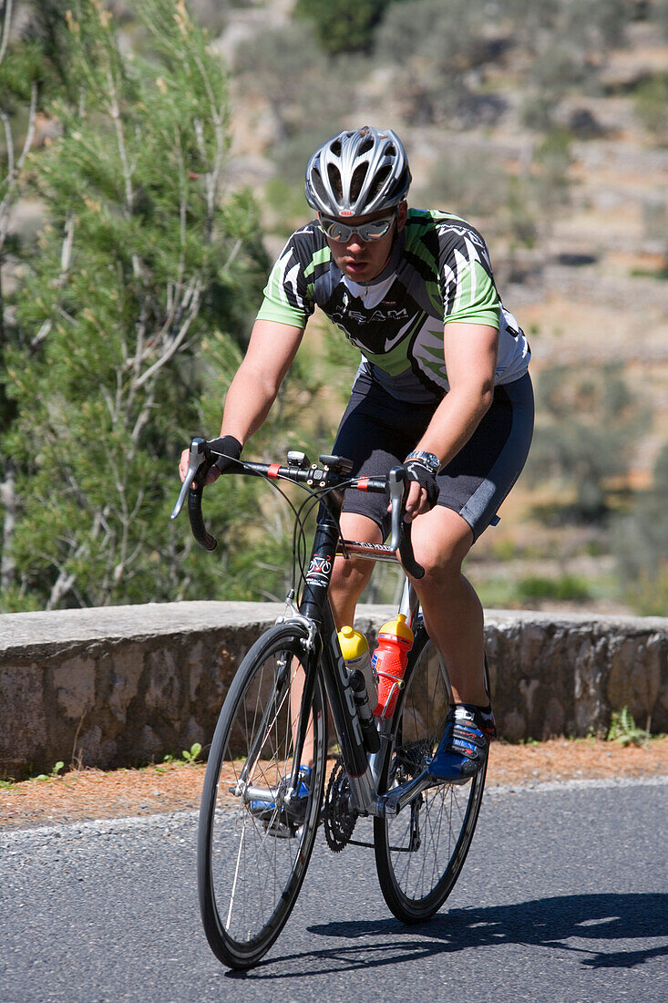 Cyclist on Mountain Pass, Serra de Tramuntana Mountains, near Caimari, Mallorca, Balearic Islands, Spain